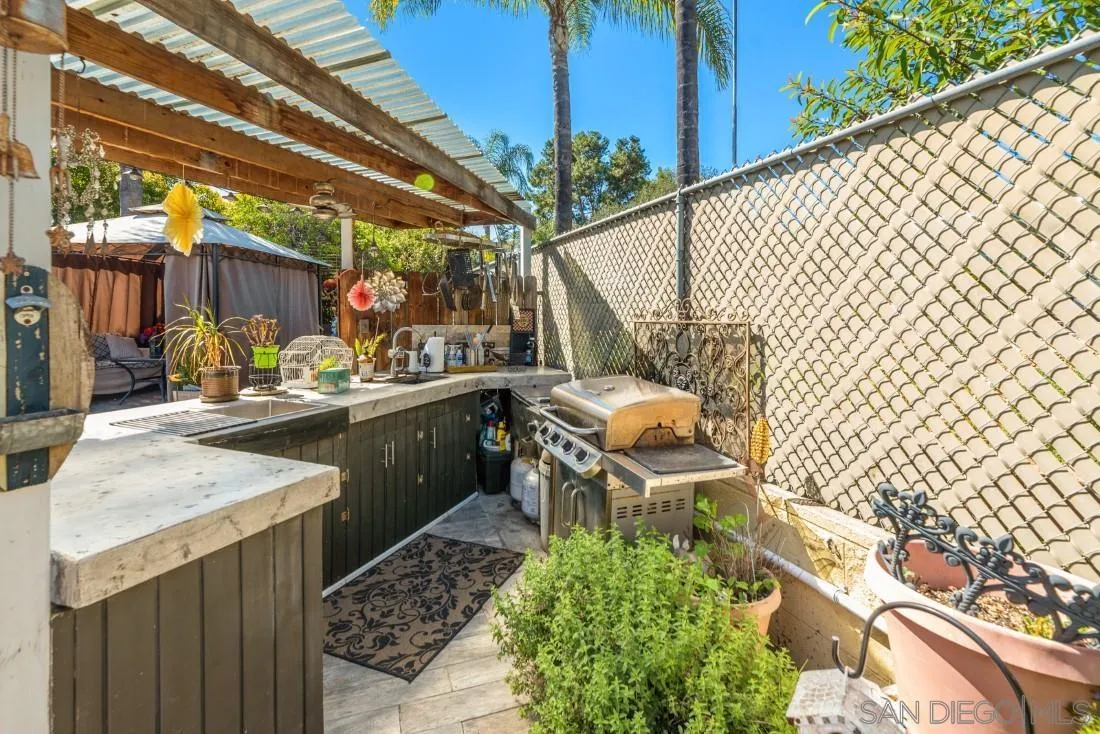 12814 Iola Way Poway, CA 92064 - Photo 28 of 36 a view of a patio with table and chairs