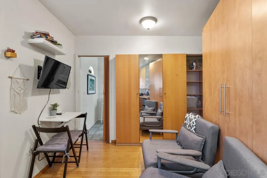 12814 Iola Way Poway, CA 92064 - Photo 33 of 36 a living room with furniture a flat screen tv and a large window