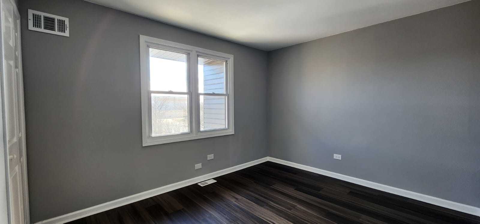 Undisclosed Address Alsip, IL 60803 - Photo 16 of 24 a view of an empty room with wooden floor and a window