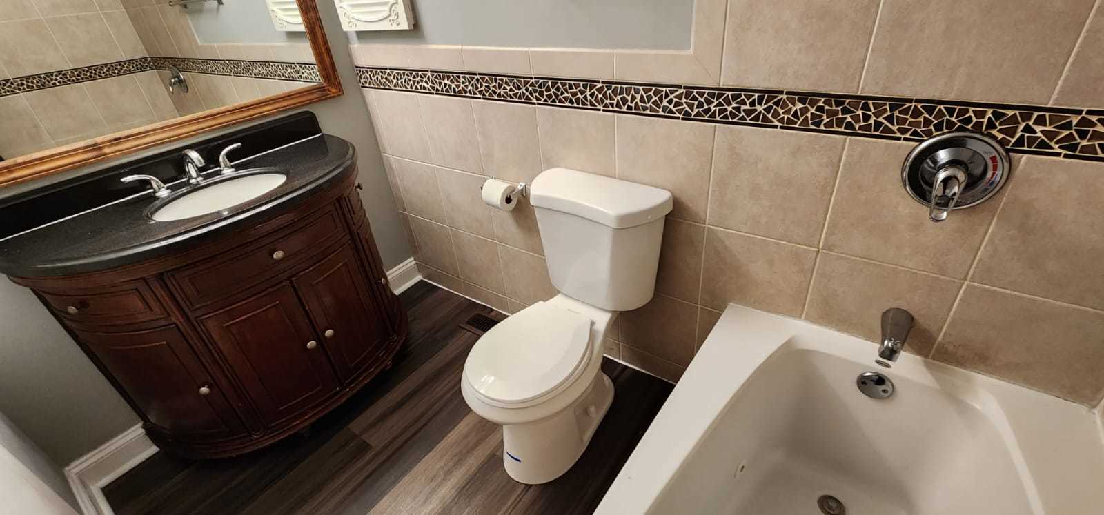 Undisclosed Address Alsip, IL 60803 - Photo 22 of 24 a bathroom with a toilet and a shower