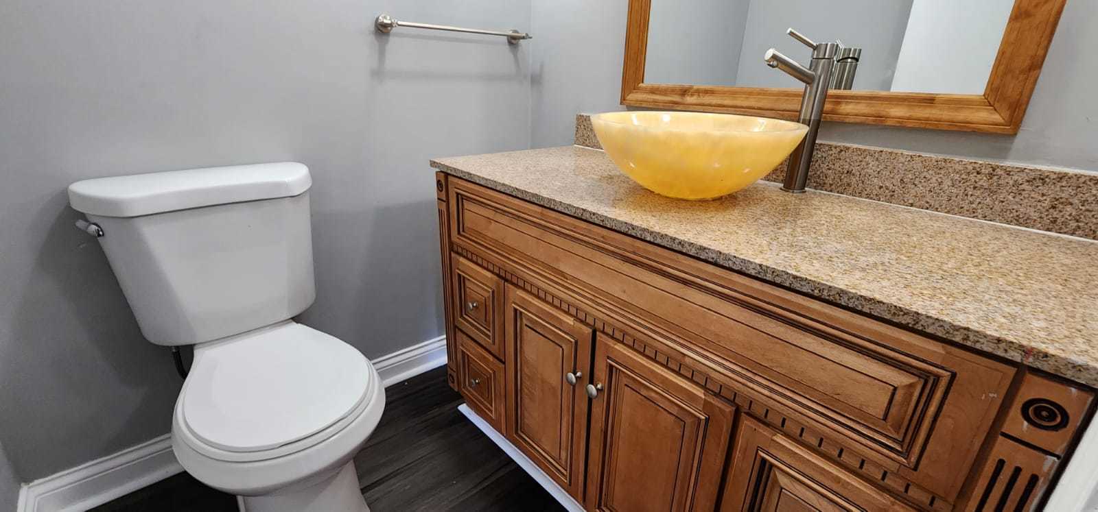 Undisclosed Address Alsip, IL 60803 - Photo 24 of 24 a bathroom with a granite countertop toilet and a sink