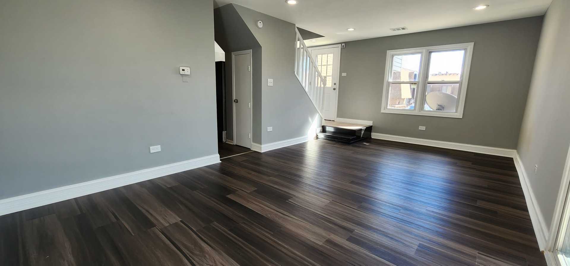 Undisclosed Address Alsip, IL 60803 - Photo 7 of 24 a view of an empty room with wooden floor and a window