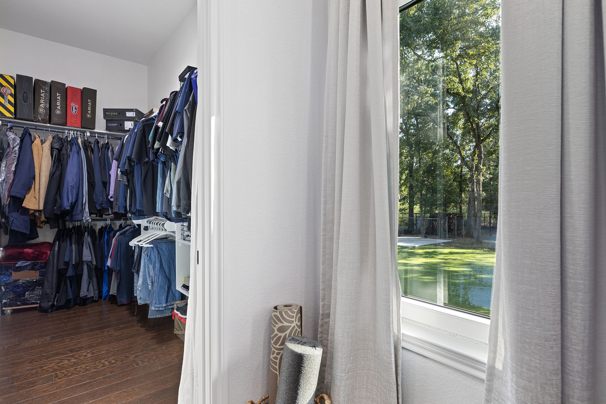 153 Fawn Hollow Elgin, TX 78621 - Photo 23 of 40 a view of walk in closet with clothes and shoes