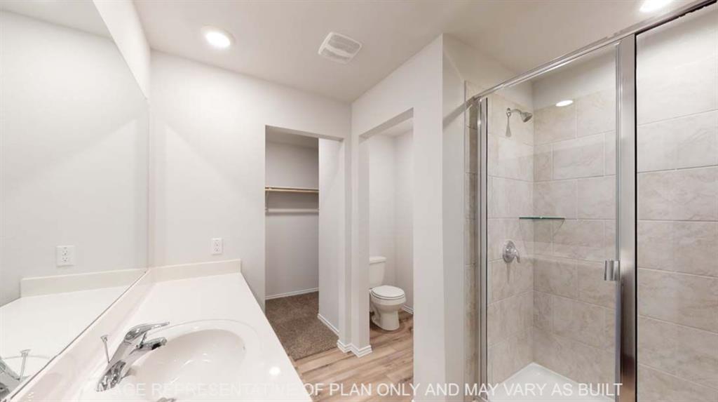 10428 Neptune Court Waco, TX 76708 - Photo 7 of 12 White vanity with integrated sink, chrome faucet, and expansive wall mirror