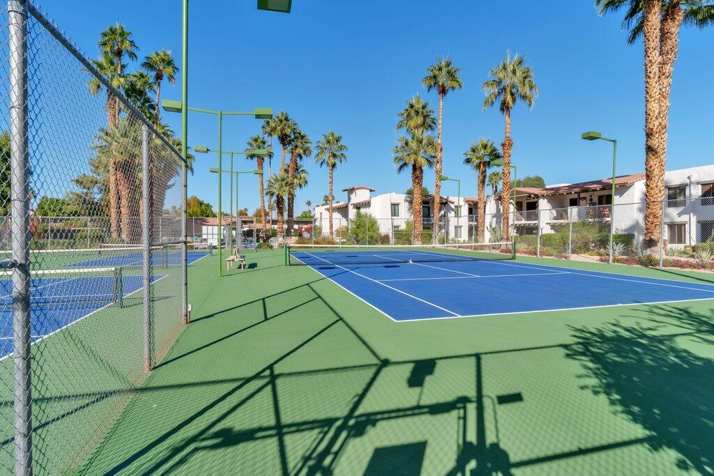 1050 Ramon Road, Unit 3 Palm Springs, CA 92264 - Photo 28 of 28 a view of a tennis ground with large trees
