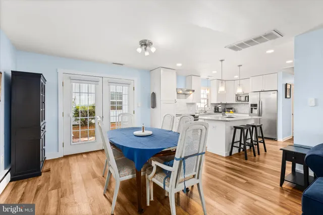 a view of a livingroom with furniture window and wooden floor