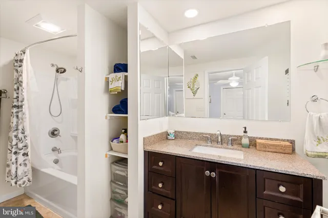 a bathroom with a double vanity sink a and a window