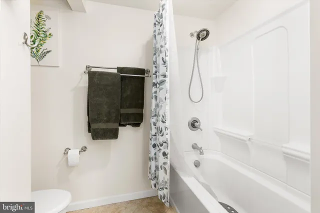 a bedroom with a bed and a desk