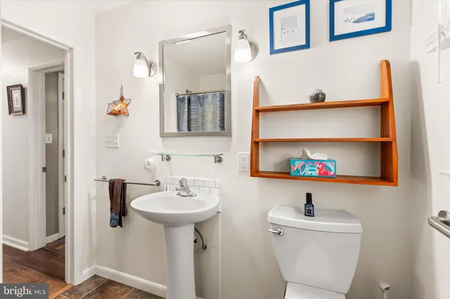 a bedroom with furniture and a rug