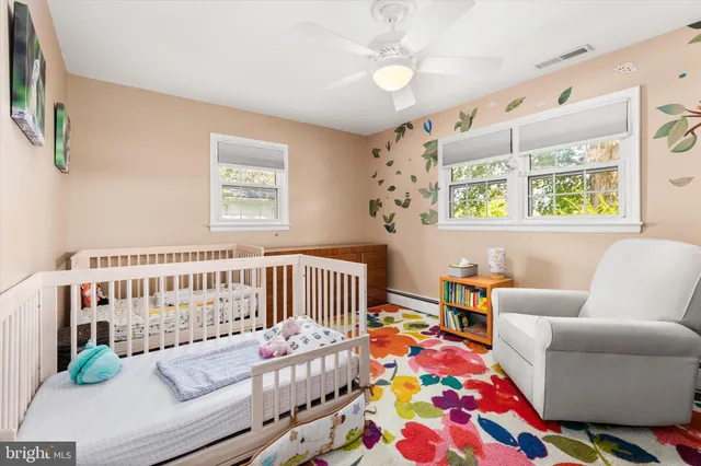a living room with blue walls and a dining table