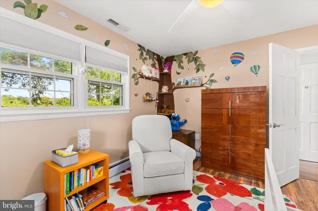 a spacious bedroom with a bed and a cabinets