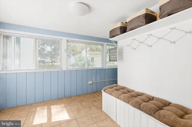 a view of a kitchen with fridge and hallway