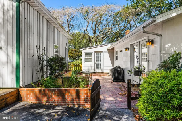 a swimming pool with outdoor seating and yard