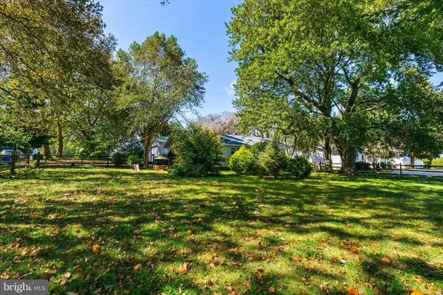 a view of a patio with table and chairs and potted plants