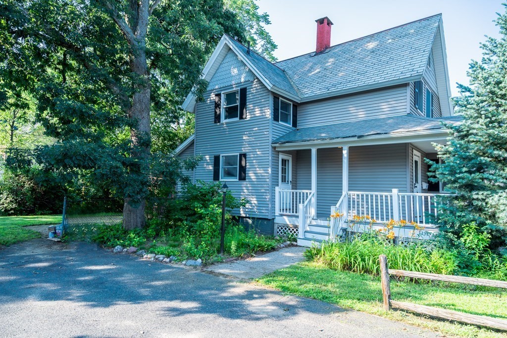 67 Keith Street Springfield, MA 01108 - Photo 3 of 27 a front view of a house with a garden