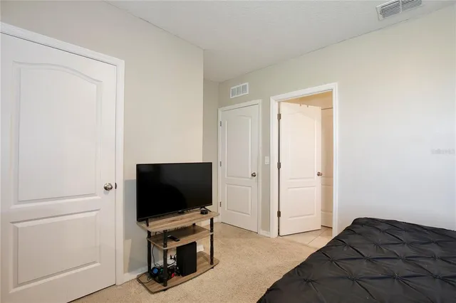 a front view of a house with a garden and plants