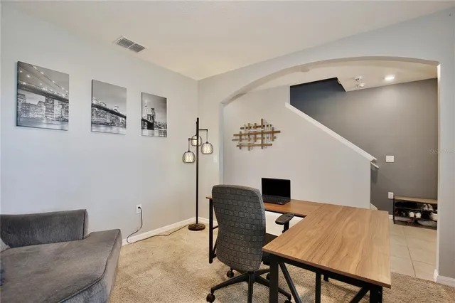 a view of a dining room with furniture and window