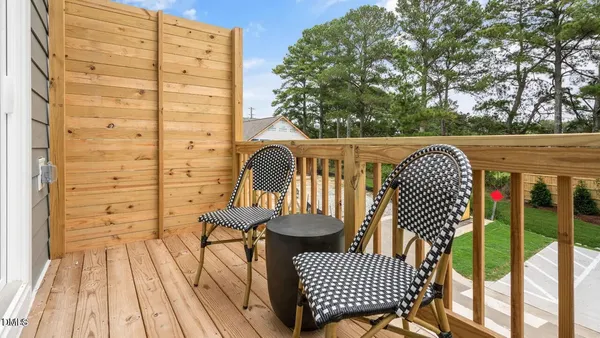 a view of a backyard with plants and a patio