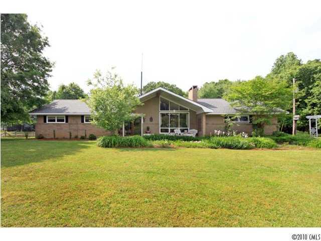 2219 Long Hope Road Monroe, NC 28112 - Photo 2 of 16 a front view of house with yard and car parked