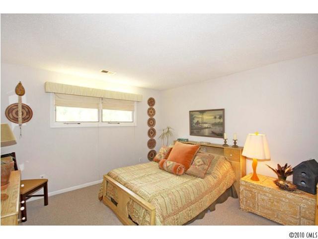 2219 Long Hope Road Monroe, NC 28112 - Photo 15 of 16 a bedroom with a bed and cabinets