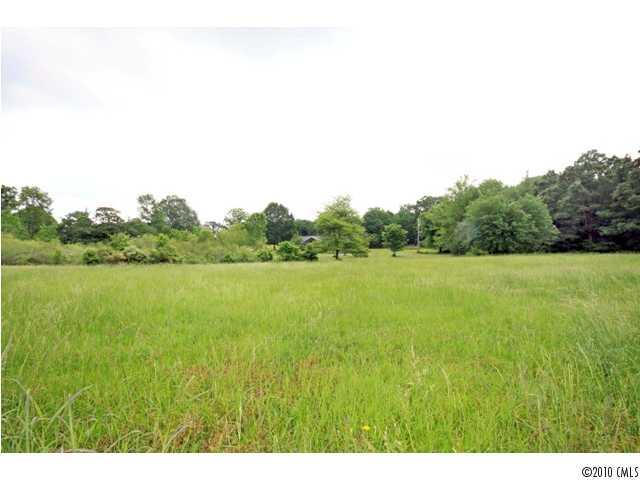 2219 Long Hope Road Monroe, NC 28112 - Photo 5 of 16 a view of a lake and yard