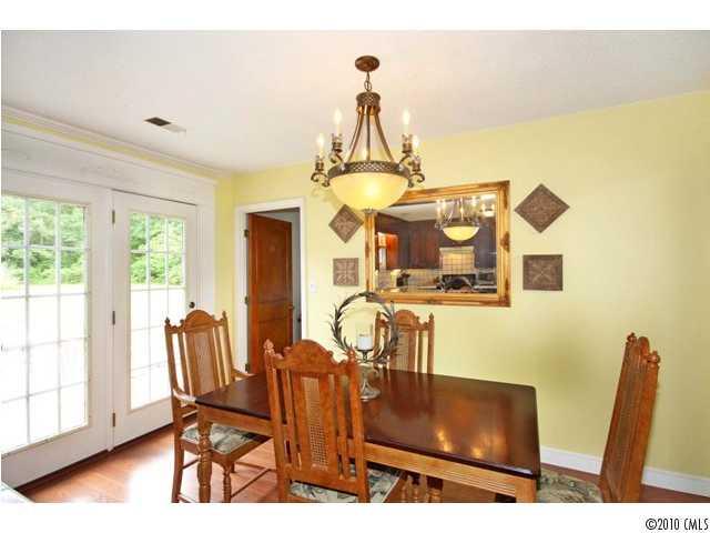 2219 Long Hope Road Monroe, NC 28112 - Photo 10 of 16 a dining room with furniture and wooden floor