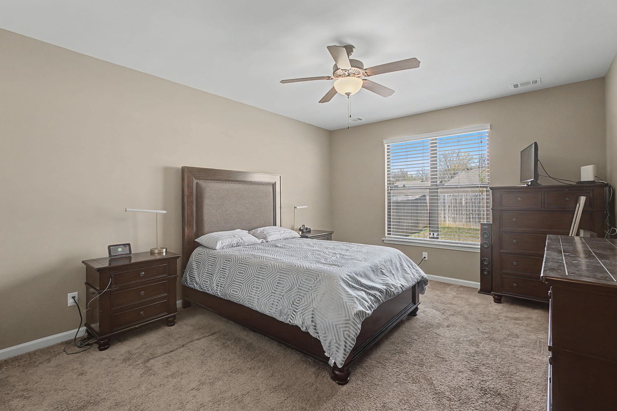 12436 Dusty Field Road Arlington, TN 38002 - Photo 17 of 40 Bedroom with light colored carpet and a ceiling fan