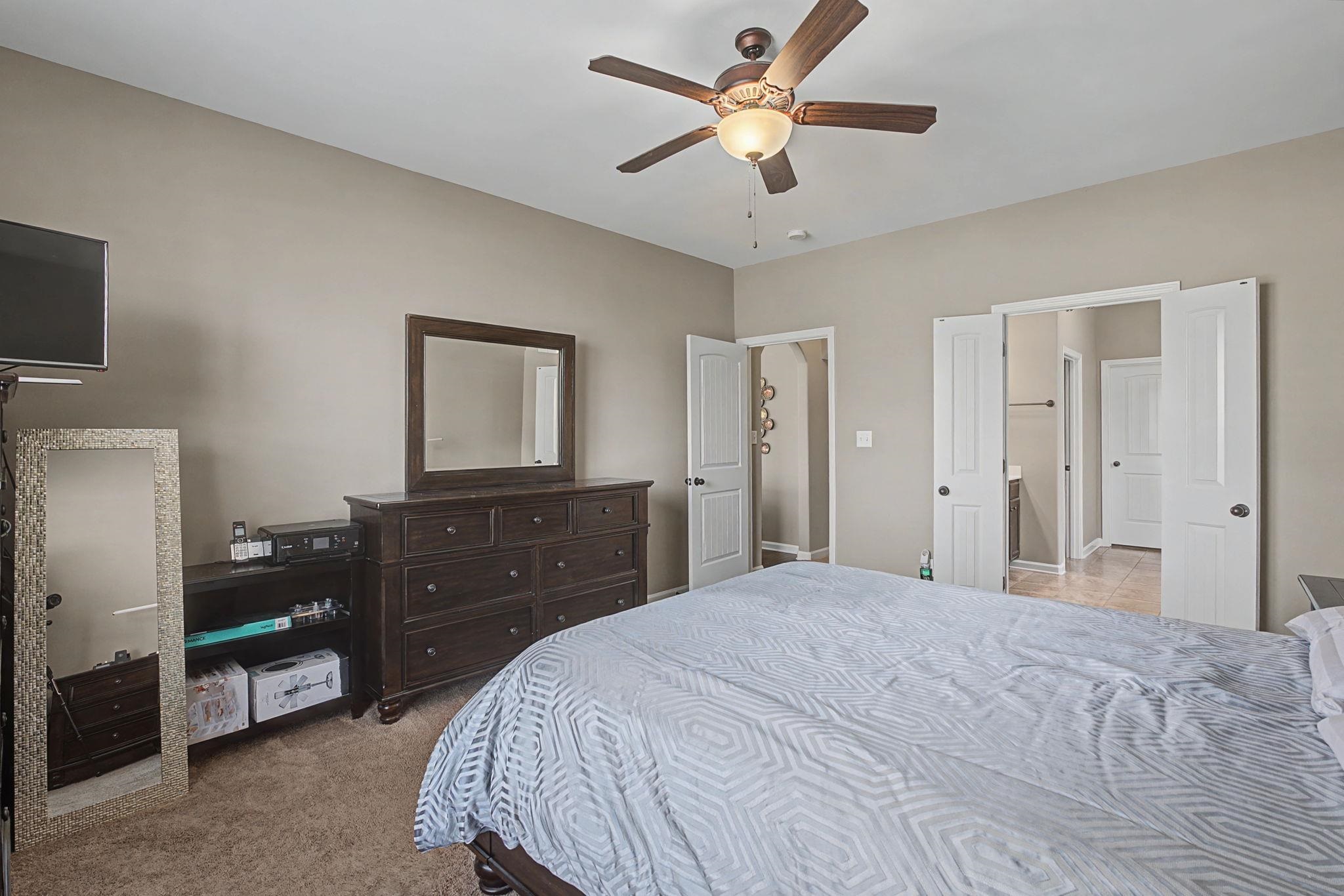 12436 Dusty Field Road Arlington, TN 38002 - Photo 19 of 40 Bedroom with light colored carpet and a ceiling fan