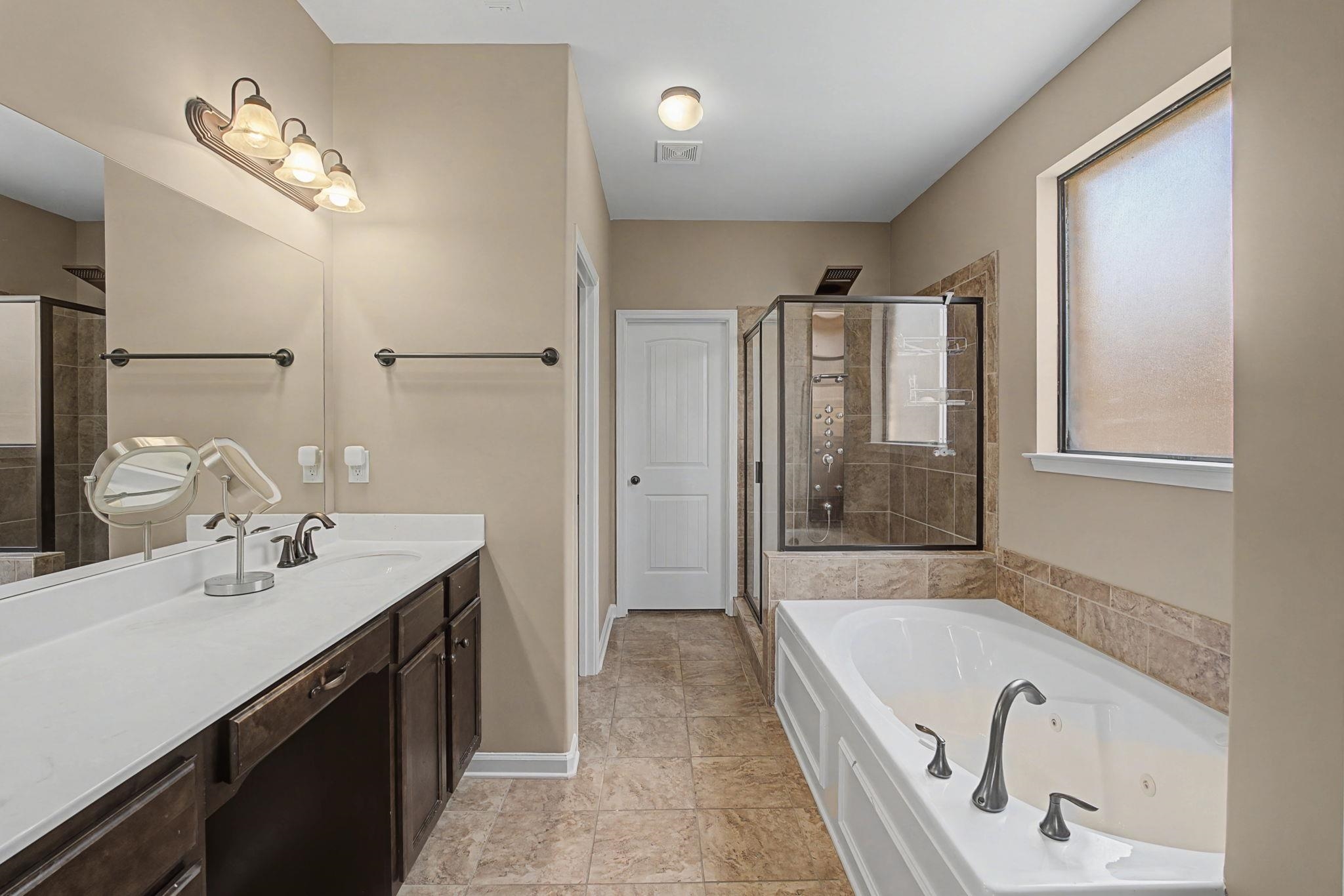 12436 Dusty Field Road Arlington, TN 38002 - Photo 20 of 40 Bathroom featuring vanity, a stall shower, and a tub with jets