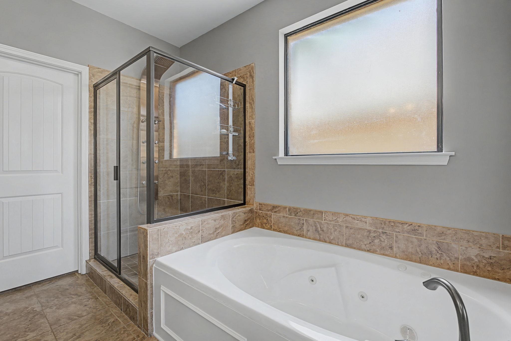 12436 Dusty Field Road Arlington, TN 38002 - Photo 21 of 40 Full bathroom with a stall shower and a whirlpool tub