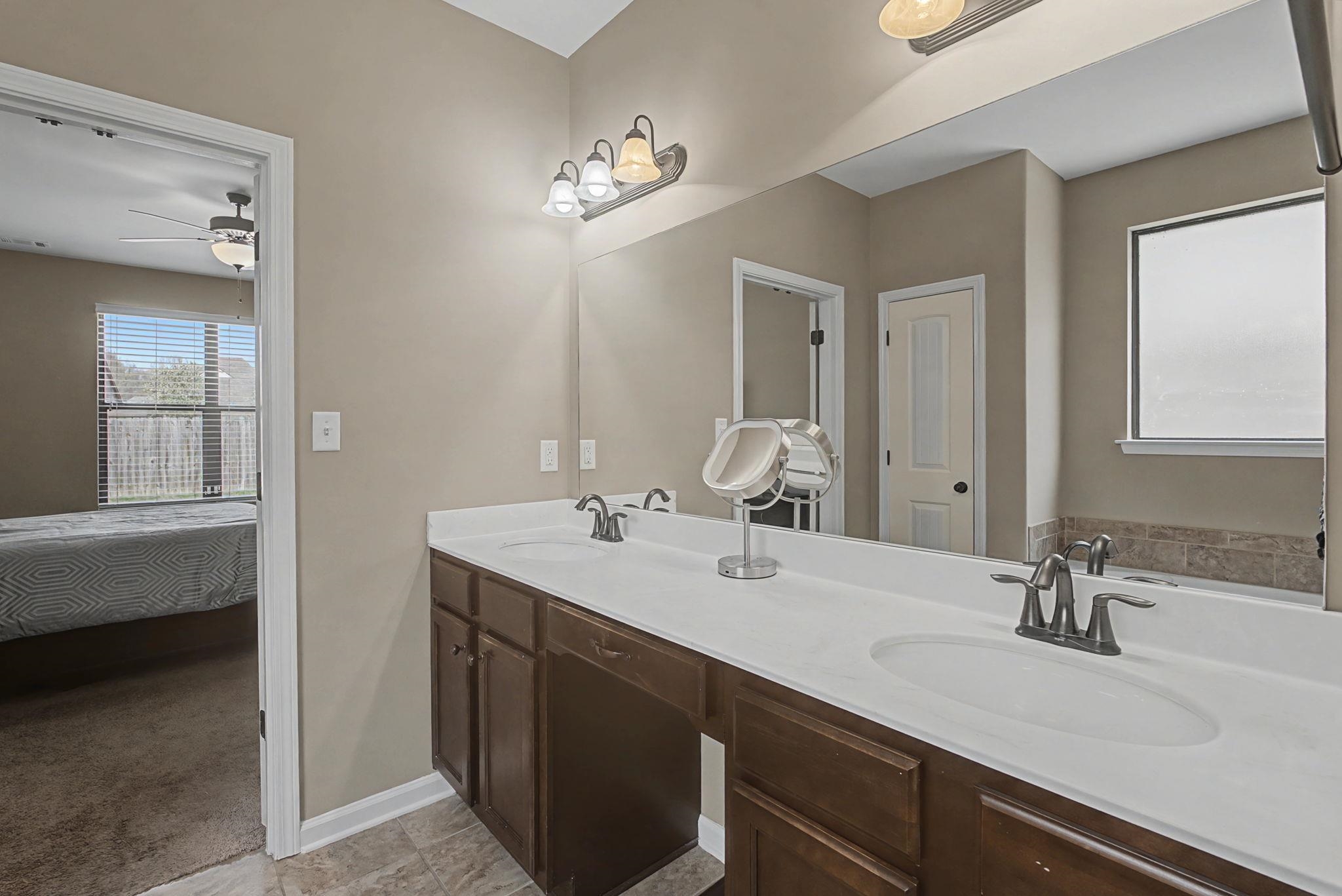 12436 Dusty Field Road Arlington, TN 38002 - Photo 22 of 40 Bathroom featuring ensuite bath, double vanity, and ceiling fan