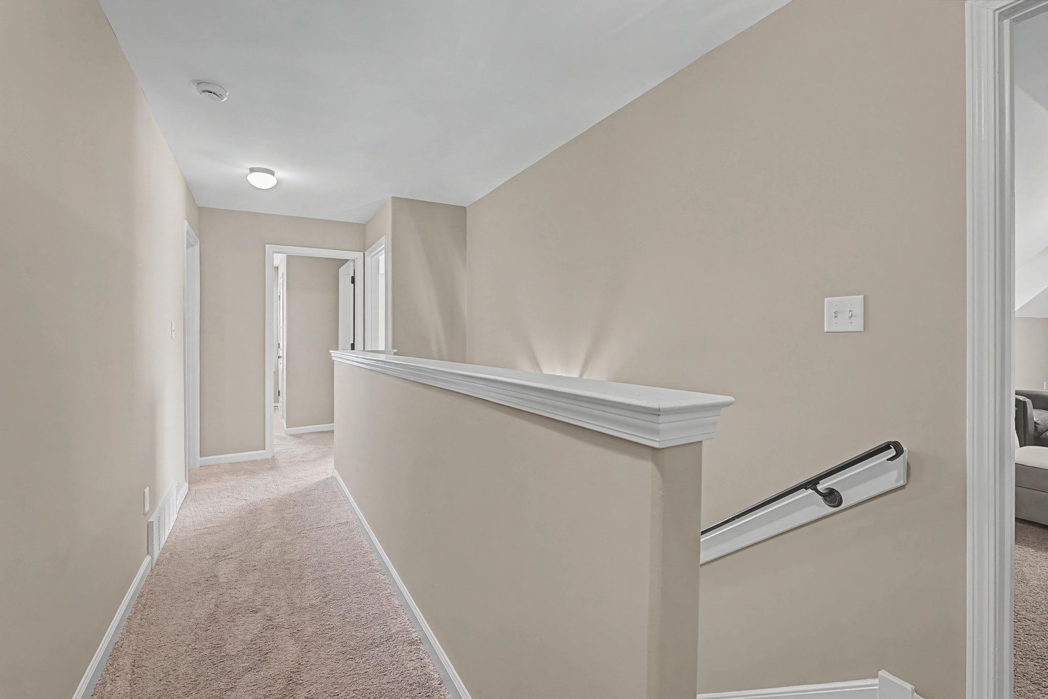 12436 Dusty Field Road Arlington, TN 38002 - Photo 26 of 40 Hallway with an upstairs landing and light carpet