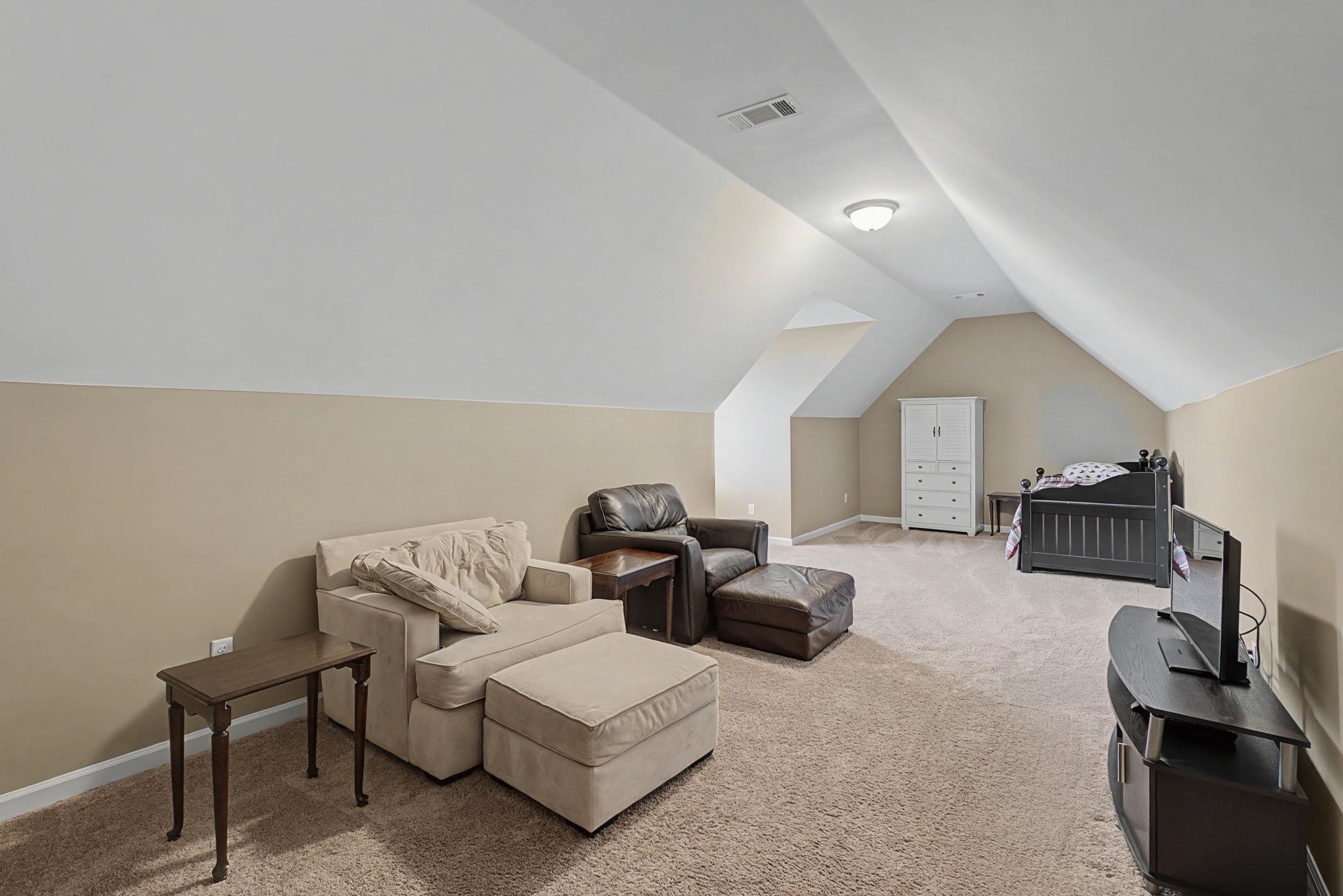 12436 Dusty Field Road Arlington, TN 38002 - Photo 29 of 40 Bedroom featuring light colored carpet and vaulted ceiling