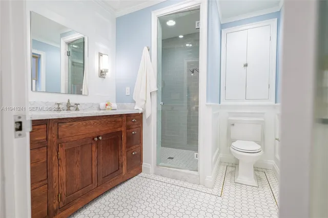 a bathroom with a toilet a sink and shower