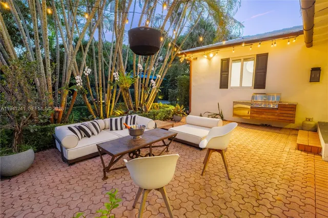 a balcony with table and chairs