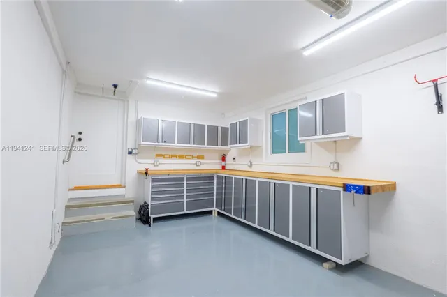 a room with furniture and white walls