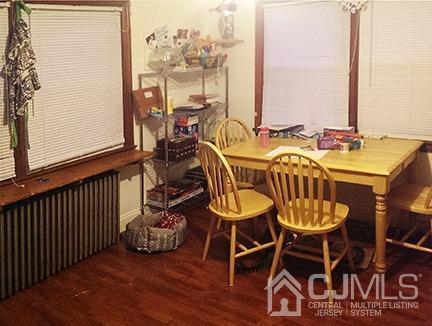 165 Pond Road Freehold, NJ 07728 - Photo 6 of 43 a view of a dining room with furniture window and wooden floor