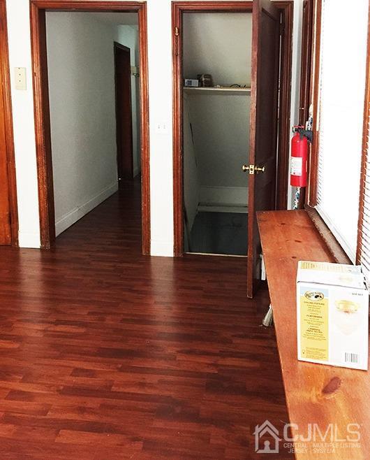 165 Pond Road Freehold, NJ 07728 - Photo 8 of 43 a view of hallway with wooden floor