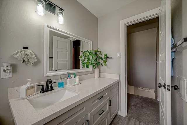 a bathroom with a sink and a mirror