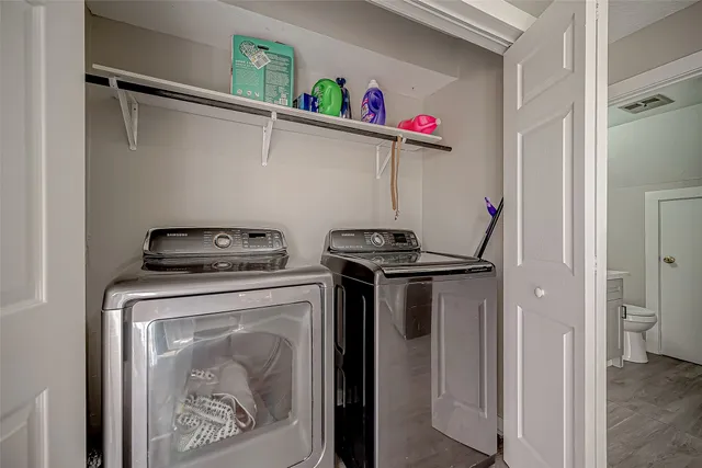 a utility room with dryer and washer