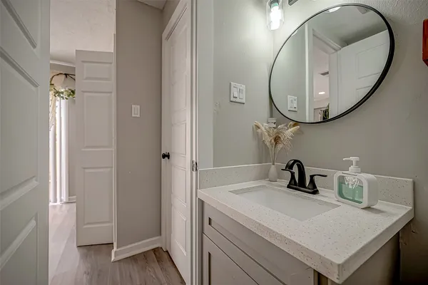 a bathroom with a sink and a mirror