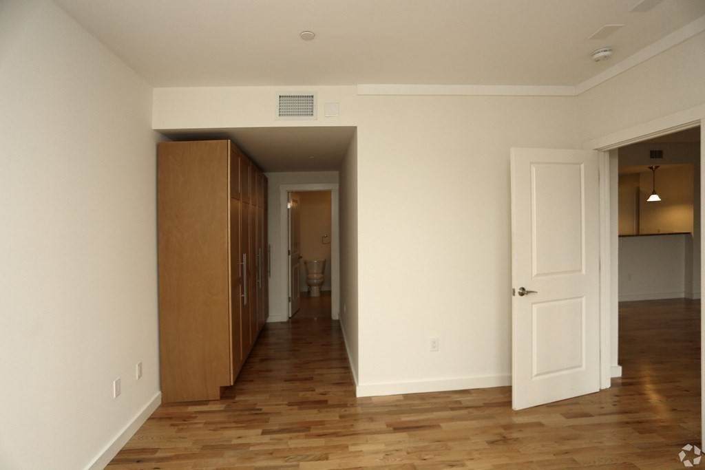 87 New Street, Unit 204 Cambridge, MA 02138 - Photo 7 of 14 a view of hallway with wooden floor