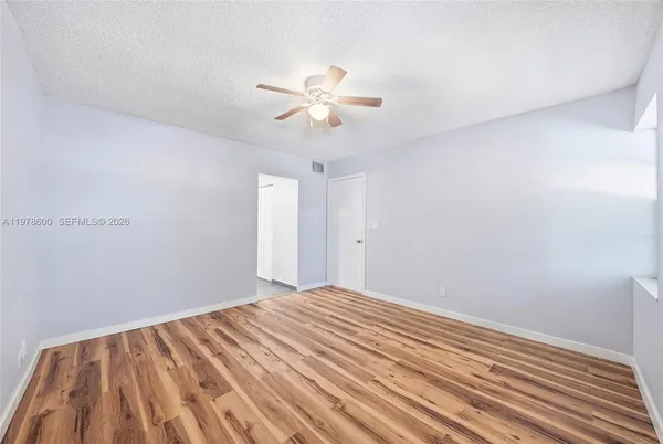 a bathroom with a bathtub and a toilet