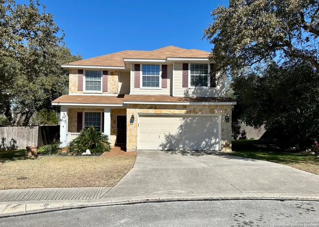 a front view of a house with yard