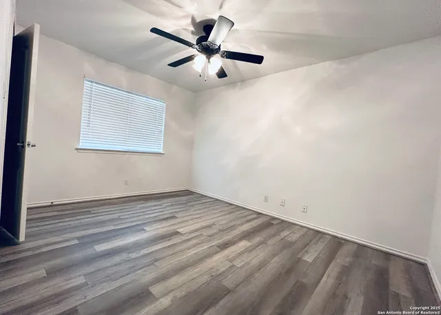 a view of gallery with wooden floor