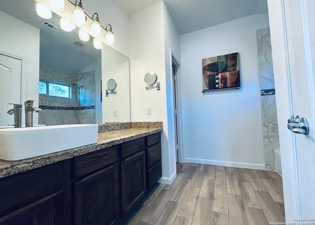 a bathroom with a bathtub and a shower