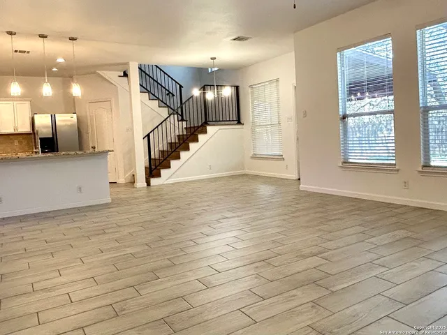 a view of a hallway with stairs