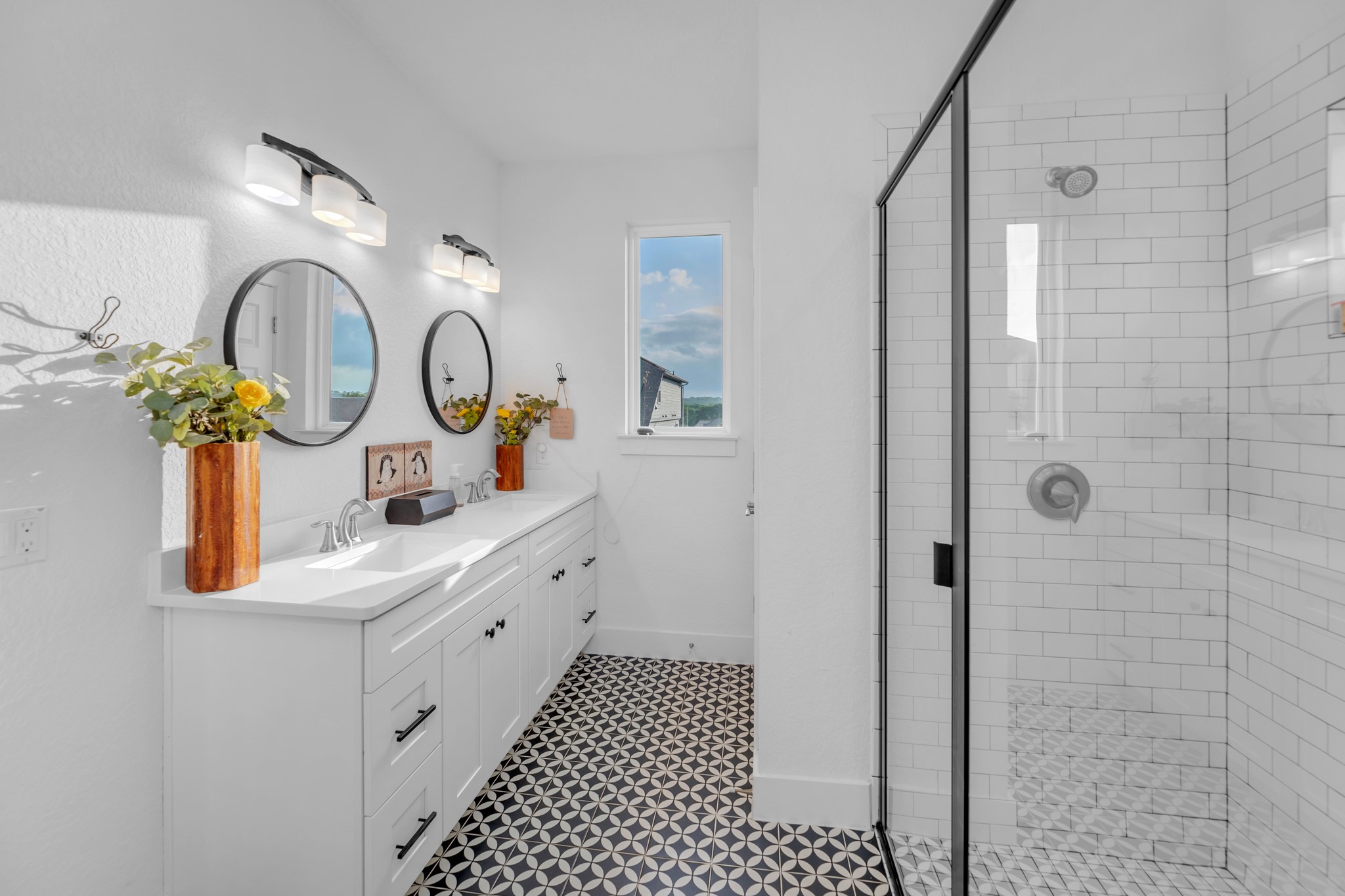 16512 Fetching Avenue Manor, TX 78653 - Photo 21 of 39 Full bath featuring a sink, baseboards, double vanity, and a shower stall