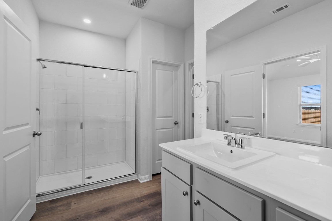 125 Hatari Trail Jarrell, TX 76537 - Photo 20 of 40 a bathroom with a sink and a mirror