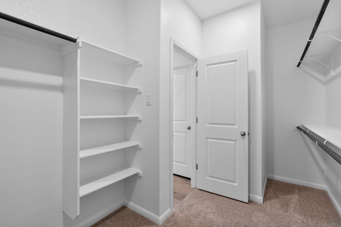 125 Hatari Trail Jarrell, TX 76537 - Photo 25 of 40 a view of an empty walk in closet